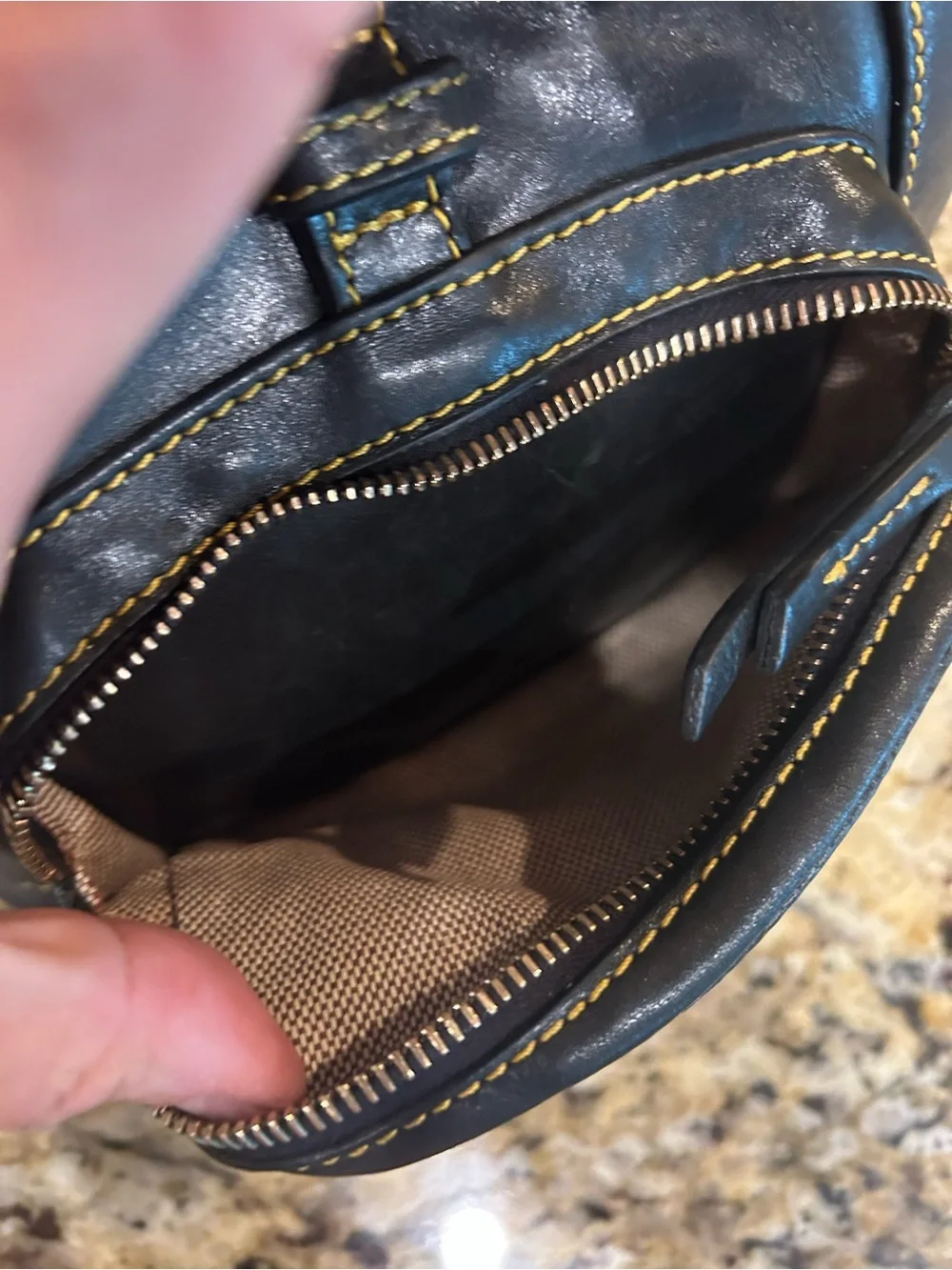 Dooney & Bourke Black Leather Drawstring Backpack with Yellow Stitching
